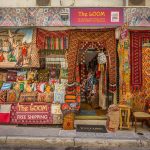 More Greece Street view of colourful fabric shop in Plaka District of Athens, Athens, Greece